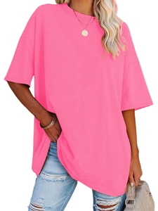 Close-up of vibrant pink loose fit women's T-shirt with round neck and drop shoulders