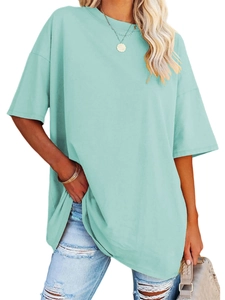 Detail of loose fit mint green oversize t-shirt with crew neck and dropped shoulders