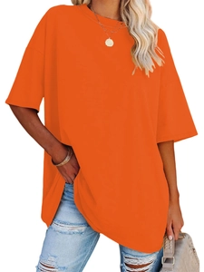 Side view of oversized bright orange short sleeve T-shirt with drop shoulder design