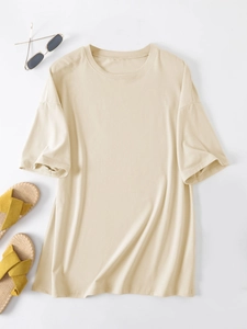 Flat lay of loose beige short sleeve T-shirt with drop shoulders and round neck