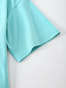 Detail shot of light blue cotton T-shirt sleeve with high-quality double-needle stitching