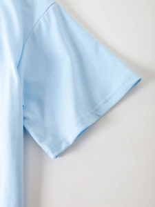 Detail of light blue t-shirt sleeve with high-quality double-needle stitching