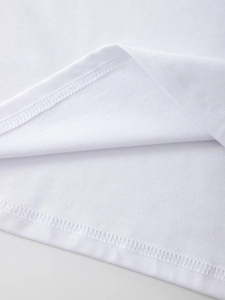 Detailed macro view of white cotton T-shirt hem with professional double-needle stitching