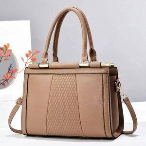 Brown quilted patchwork handbag with gold hardware and adjustable shoulder strap