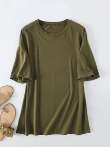 Close-up flat lay of olive green oversized women's cotton t-shirt with classic crew neck