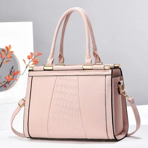 Pink faux leather tote bag featuring crocodile embossed panel and gold-tone hardware