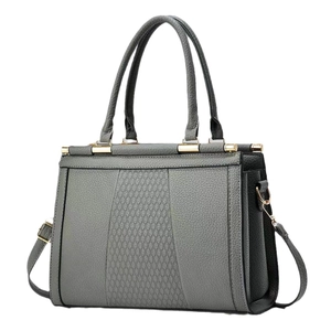 Gray quilted stitching handbag in pebbled leather with top handles and shoulder strap
