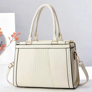 Detail view of cream white tote bag with lychee texture and vertical stripes