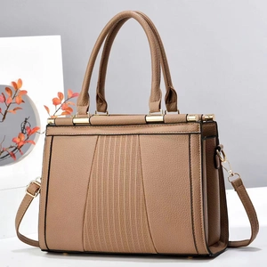 Deep camel faux leather tote bag with striped texture and golden hardware in 45-degree view