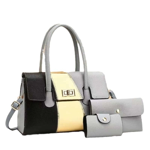 Three-piece tote bag set in black gold and grey faux leather with metal turn-lock