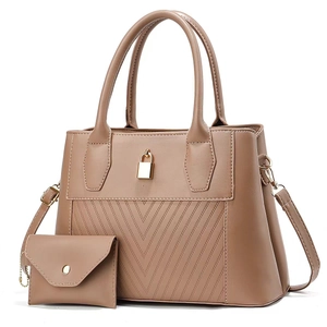 Close-up of two-piece tote bag set with V-shaped quilting and gold decorative buckle