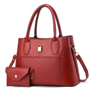 Deep red two-piece handbag set with V-shaped quilting and polished metal hardware