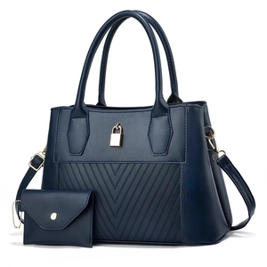 Deep blue tote bag set with V-shaped stitching and gold padlock detail for daily commute