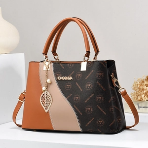 Three-color patchwork leather crossbody bag with vintage print and pearl leaf pendant