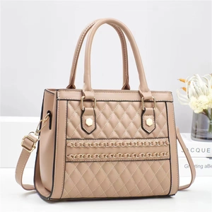Chic beige quilted shoulder bag with gold chain accents and detachable strap
