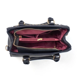 Internal structure of black leather tote bag with burgundy lining and gold zippers