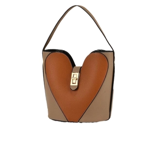 Fashionable heart-shaped patchwork crossbody bag in litchi grain leather with metal lock