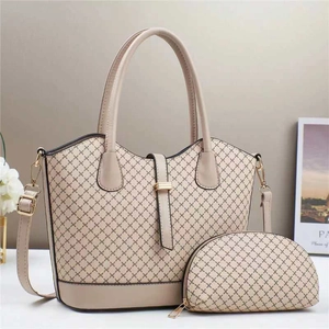 Detail of beige quilted tote bag set with detachable strap and small round pouch