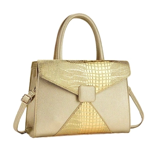 Chic gold patchwork crossbody bag with crocodile texture and sleek top handle