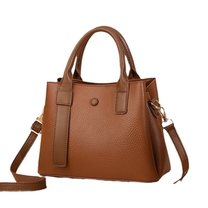 Brown lychee texture leather handbag with adjustable strap and golden hardware