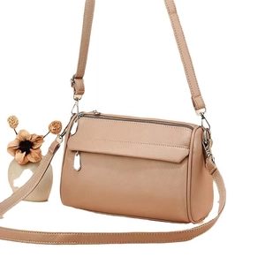 Elegant khaki lychee grain leather crossbody bag with dual zippers and woven strap