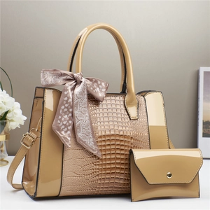 Chic beige crocodile embossed tote bag set with decorative silk scarf and gold hardware