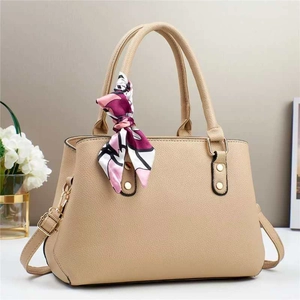 Retro beige tote bag with litchi texture and silk scarf detail on handle