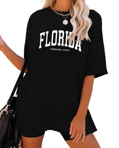 Détail du t-shirt noir oversize Florida Sunshine State avec lettrage blanc et col rond