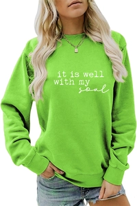 Detail of lime green sweatshirt featuring it is well with my soul typography print
