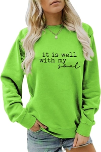 Detail of ribbed neckline and black letter print on neon green crewneck sweatshirt