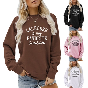 Detail of ribbed collar and cuffs on oversized lacrosse graphic sweatshirts in four colors