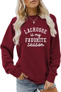 Detail of burgundy sweatshirt featuring Lacrosse is My Favorite Season white letter print