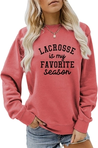 Close-up of Lacrosse Is My Favorite Season lettering on coral pink women sweatshirt
