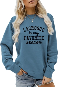Detailed close-up of blue Lacrosse sweatshirt with ribbed crew neck and letter print