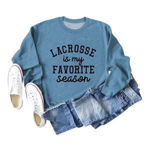Flat lay of Morandi blue Lacrosse crewneck sweatshirt with black letter print detail