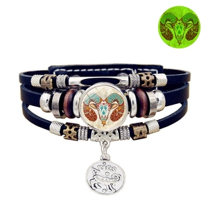 Detailed view of multilayer leather Aries zodiac bracelet with luminous glass charm