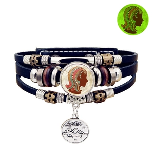 Luminous Virgo leather bracelet featuring vintage charms and glowing glass cabochon detail