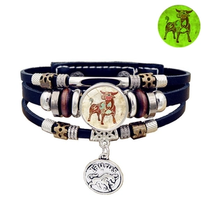 Close-up of Taurus luminous leather bracelet with vintage beads and zodiac pendant