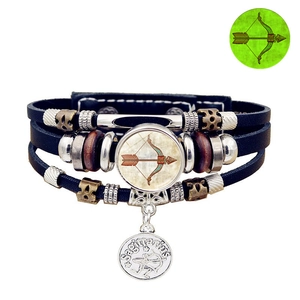 Detail of multi-layer leather Sagittarius bracelet with luminous charm and vintage beads