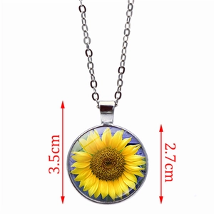 Detail view of sunflower glass pendant necklace with size dimensions 3.5cm by 2.7cm