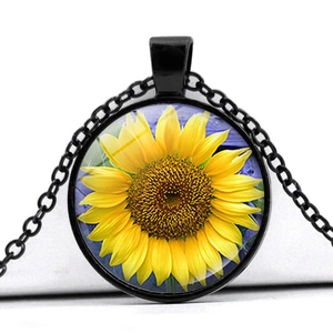 Vintage sunflower glass dome pendant necklace with black metal chain on white background