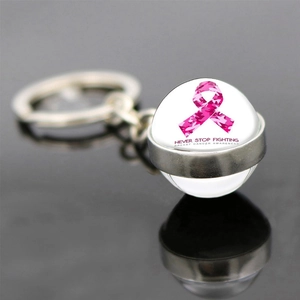 Pink ribbon breast cancer awareness keychain with Never Stop Fighting motivational text