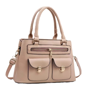 Minimalist beige pebble leather tote bag with gold metal buckles and top handles
