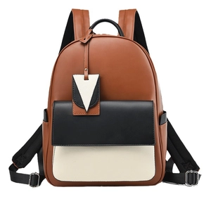 Fashionable brown leather backpack with black and white contrast pocket and silver buckle