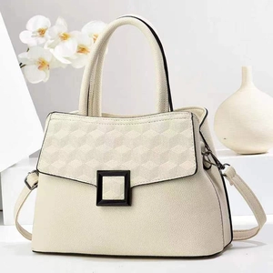 Chic beige patchwork tote bag with geometric texture and elegant black square buckle