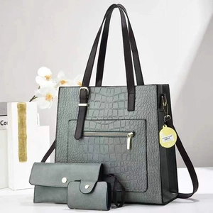 Grey crocodile embossed 3-piece tote bag set with wallet and pouch on elegant background