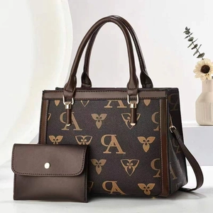 Coffee brown printed tote bag with matching envelope wallet and floral monogram pattern