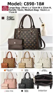 Detail view of printed faux leather handbag set with vintage pattern and multi-pocket design