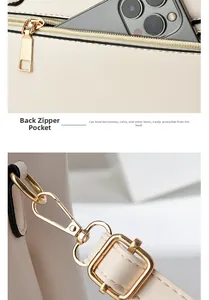 Dettaglio della borsa crema con tasca posteriore a zip e finiture in oro lucido