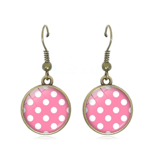Vintage pink polka dot glass dome earrings with bronze hooks for a retro chic look